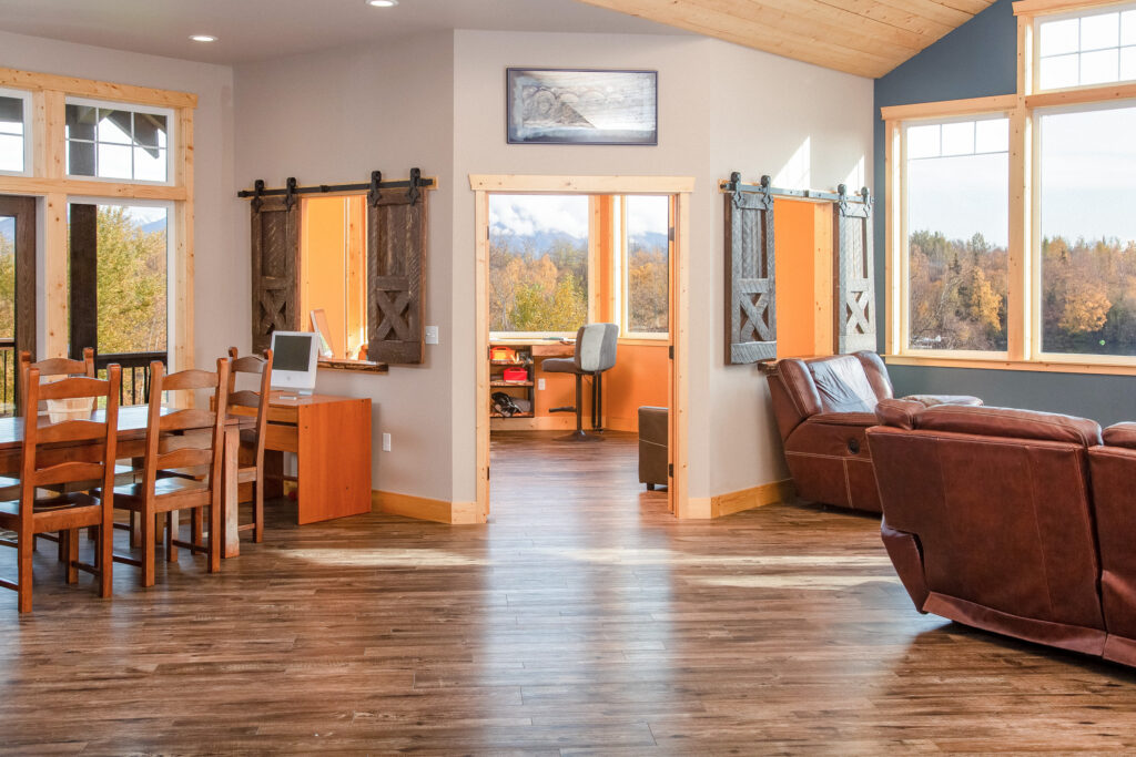 Interior of a rural home with a living room, dining room and playroom