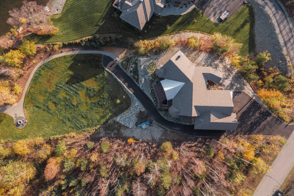 Top-down view of house with landscaping in the back yard