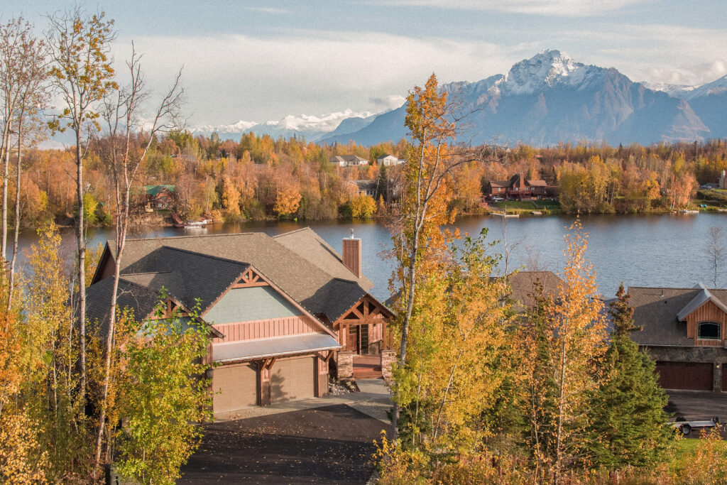 Large custom wood home built next to a lake