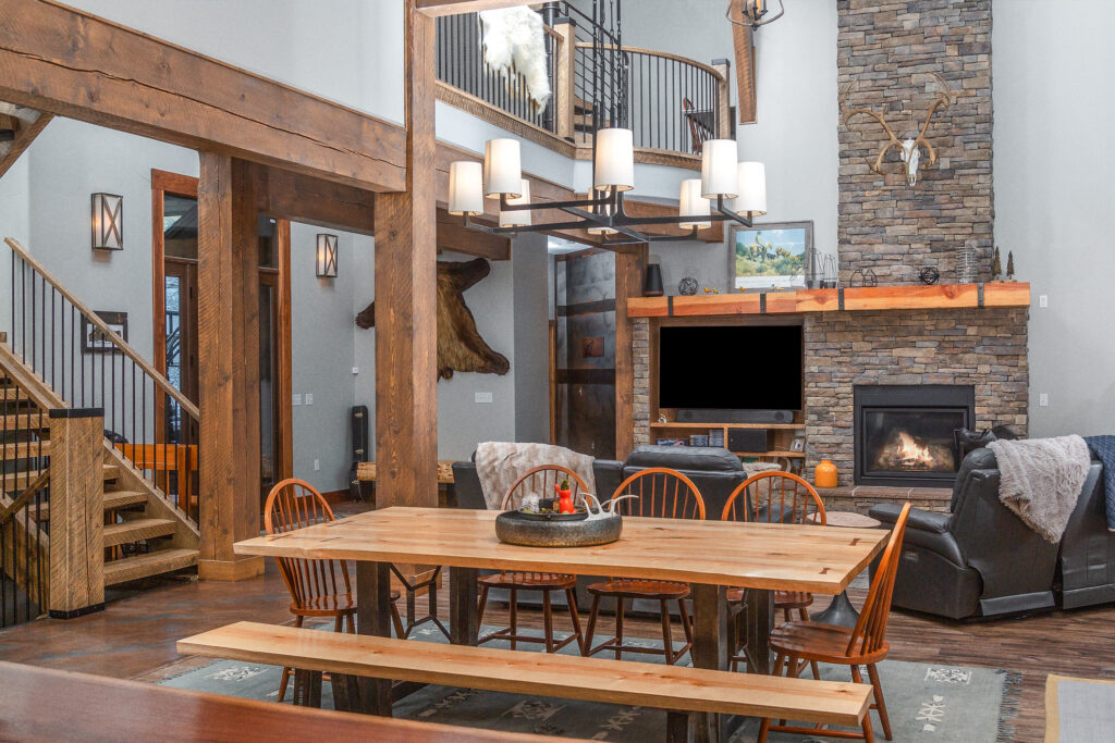 Dining room and living room of a new, rustic-looking home