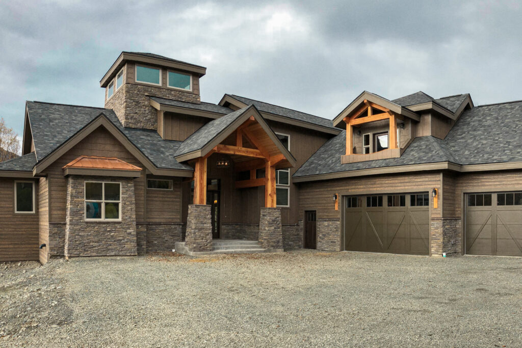Custom built brown home with exposed wood