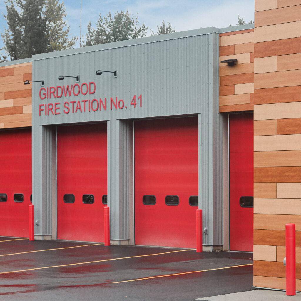 New, modern fire station with multiple red garages for firetrucks