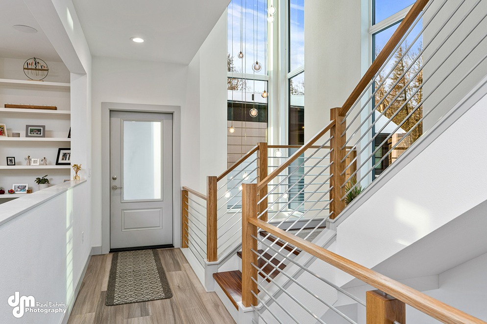 Entranceway & staircase inside modern custom built home in Alaska