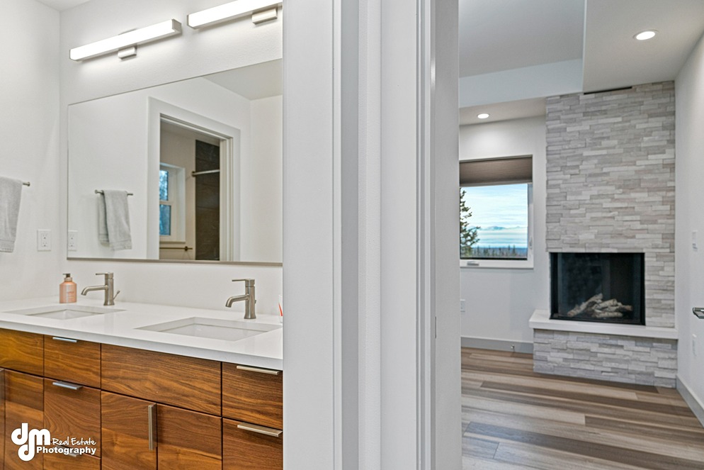 Bathroom & fireplace inside custom built home in Alaska