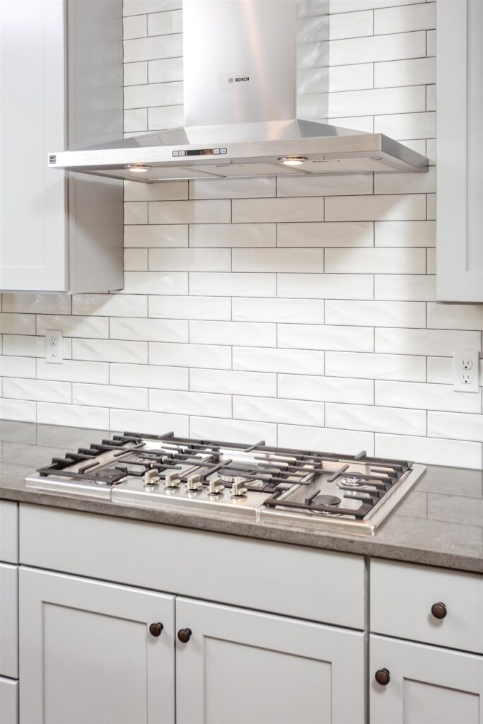 Tile work and hood in custom kitchen