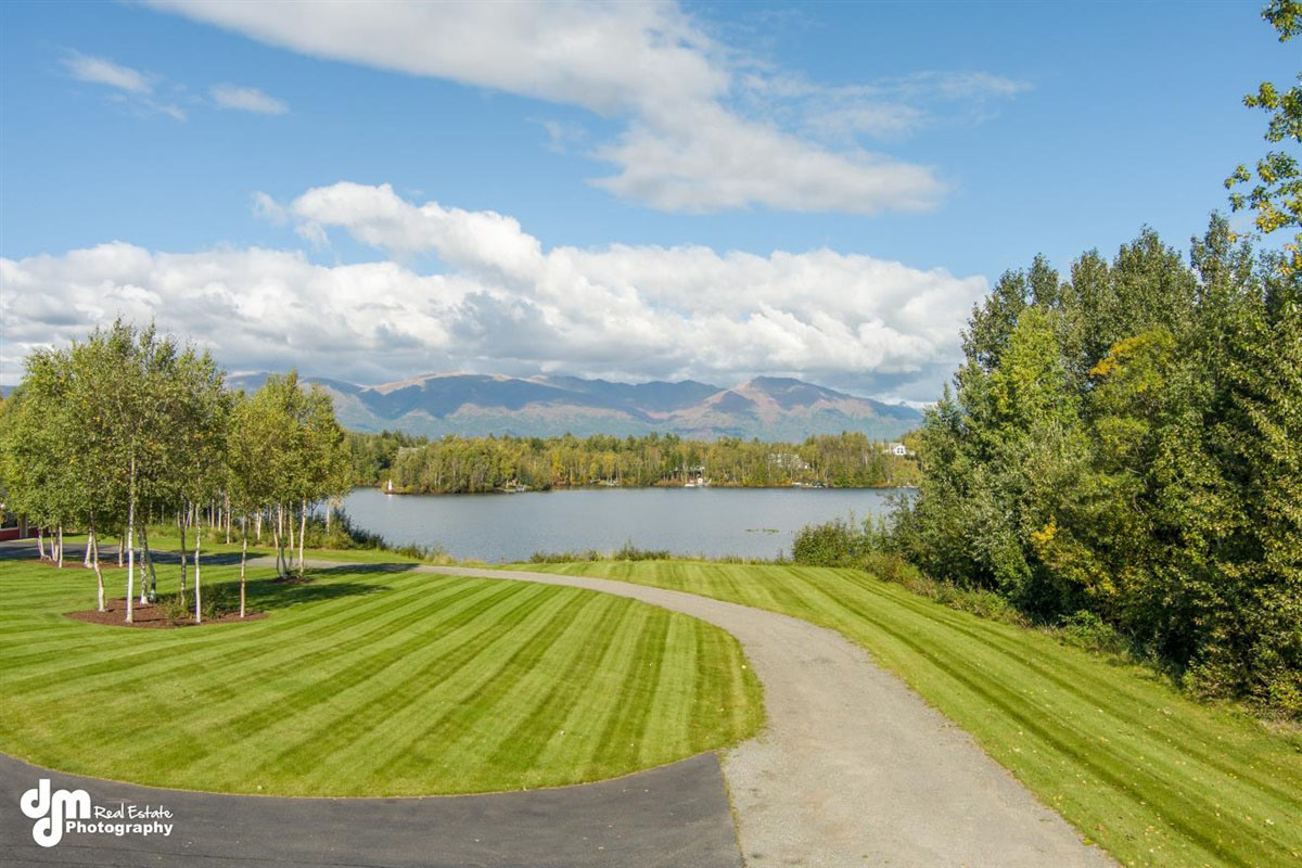 Well maintained garden in Alaska with a lake in the background
