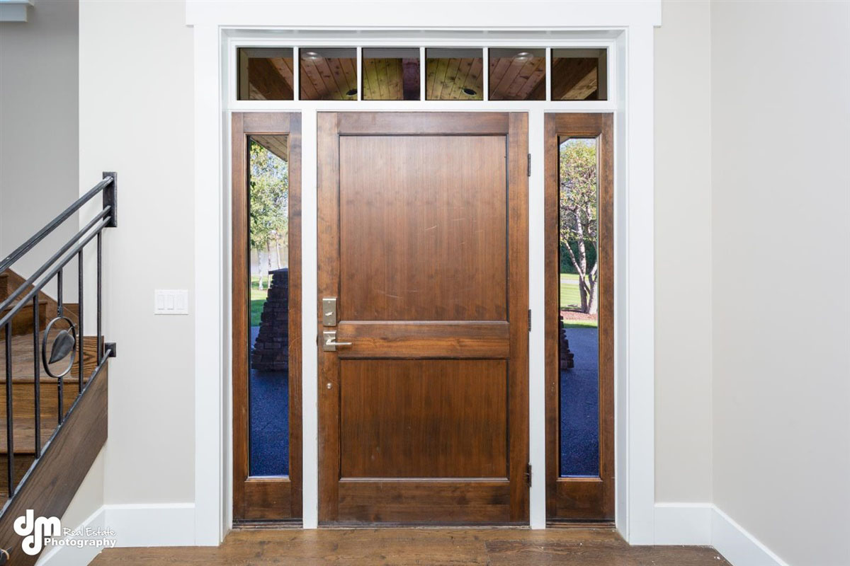 Wood front door of custom built home