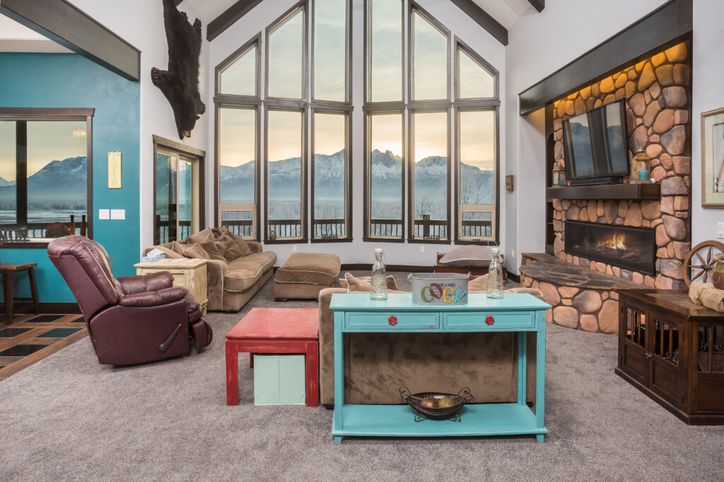 large living room with large floor to ceiling windows