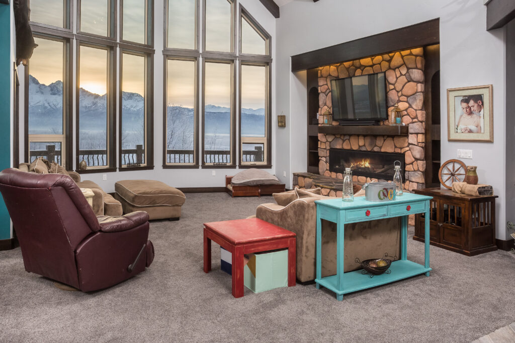 Living room with large windows and view of mountains