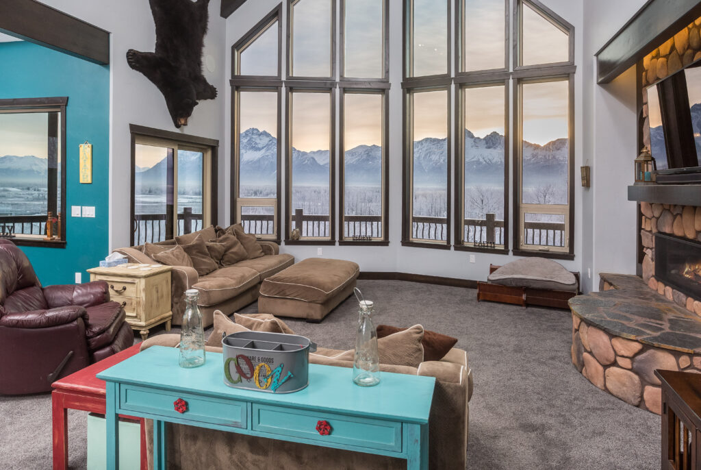 Living room with large windows and view of mountains