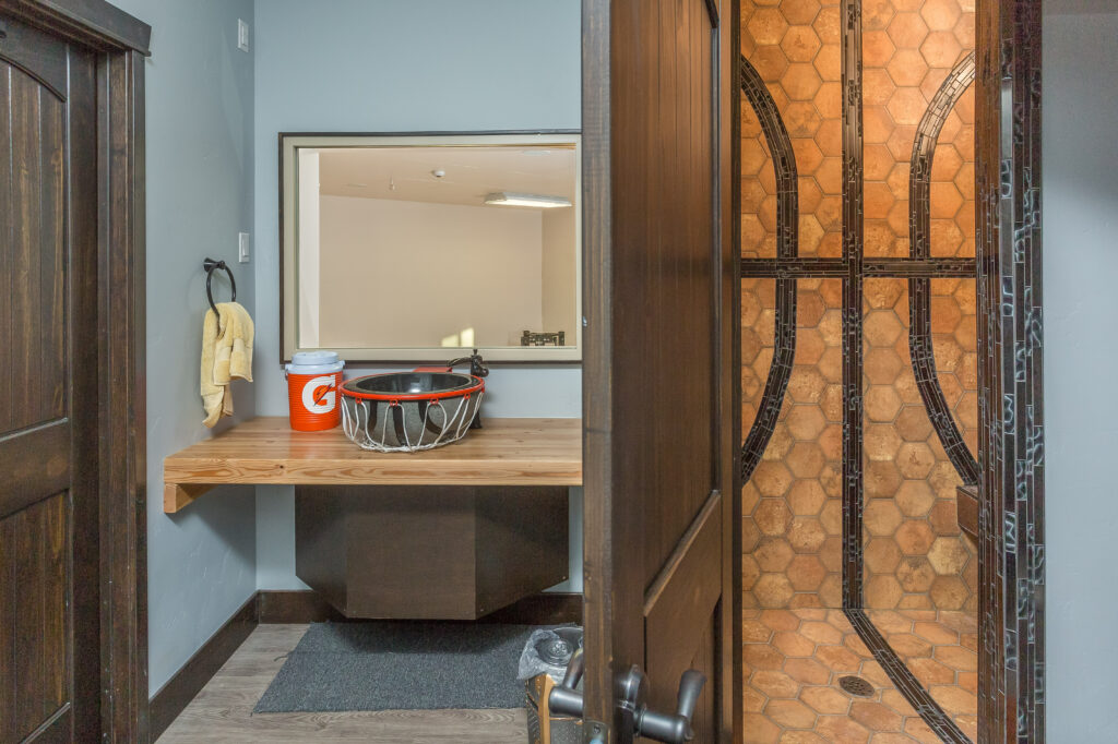 Custom basketball themed bathroom designed and built by Falcon Alaska