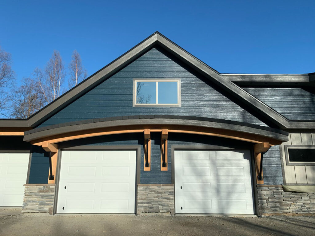 Two car garage with blue siding