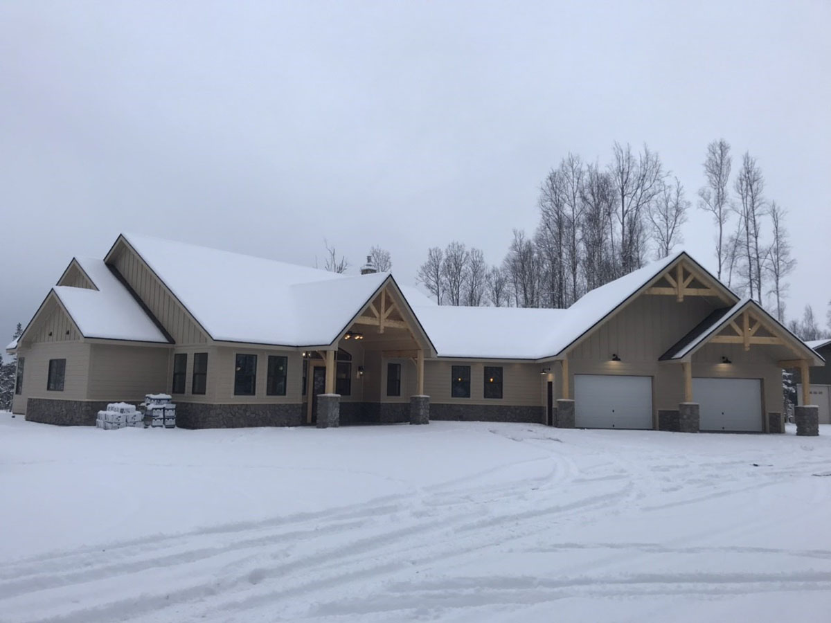 Custom built home with snow