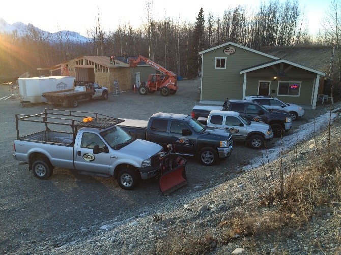 Trucks parked in front of construction site