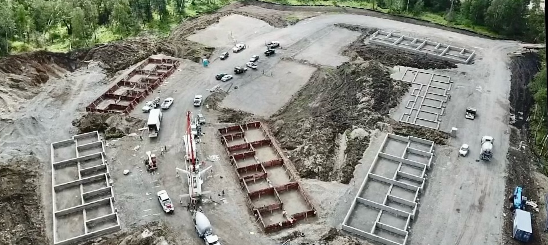 Overhead view of large concrete foundation being laid